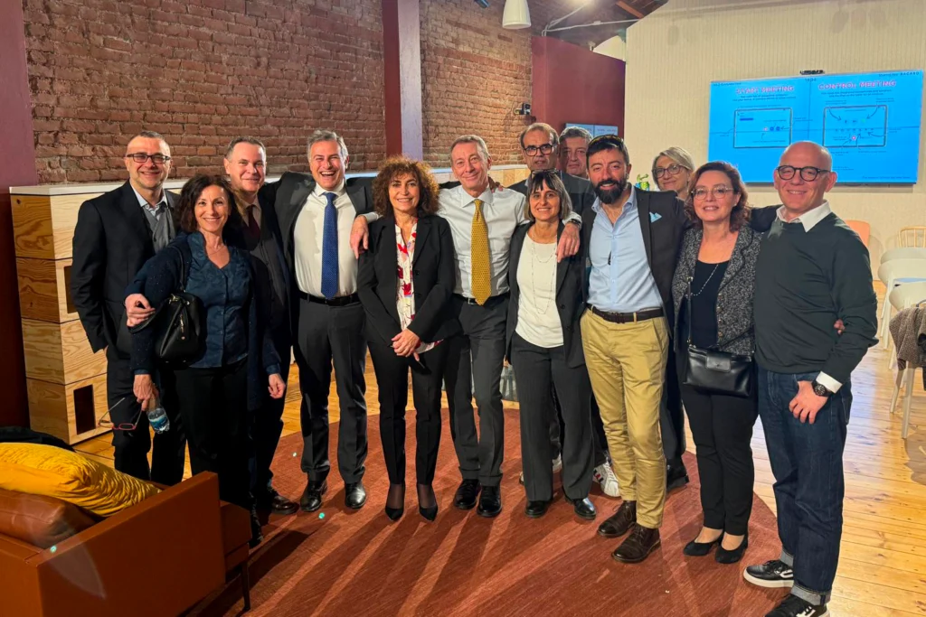 Italtel people smiling at camera