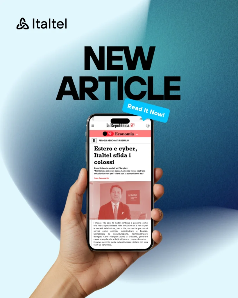 A hand holds a smartphone where a preview of the interview to CEO Carlo Filangieri is visible.