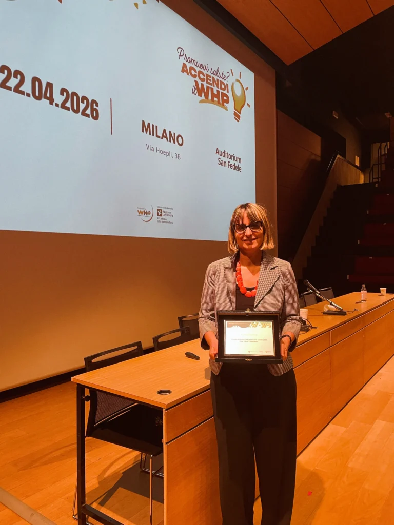 Paola Cortellese holding the certificate