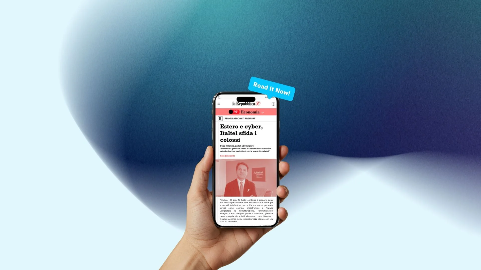 A hand holds a smartphone where a preview of the interview to CEO Carlo Filangieri is visible.